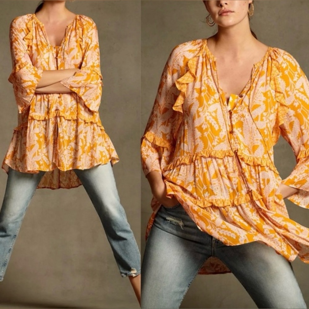 Anthropologie top in Orange and White. Size S excellent condition. Semi sheer